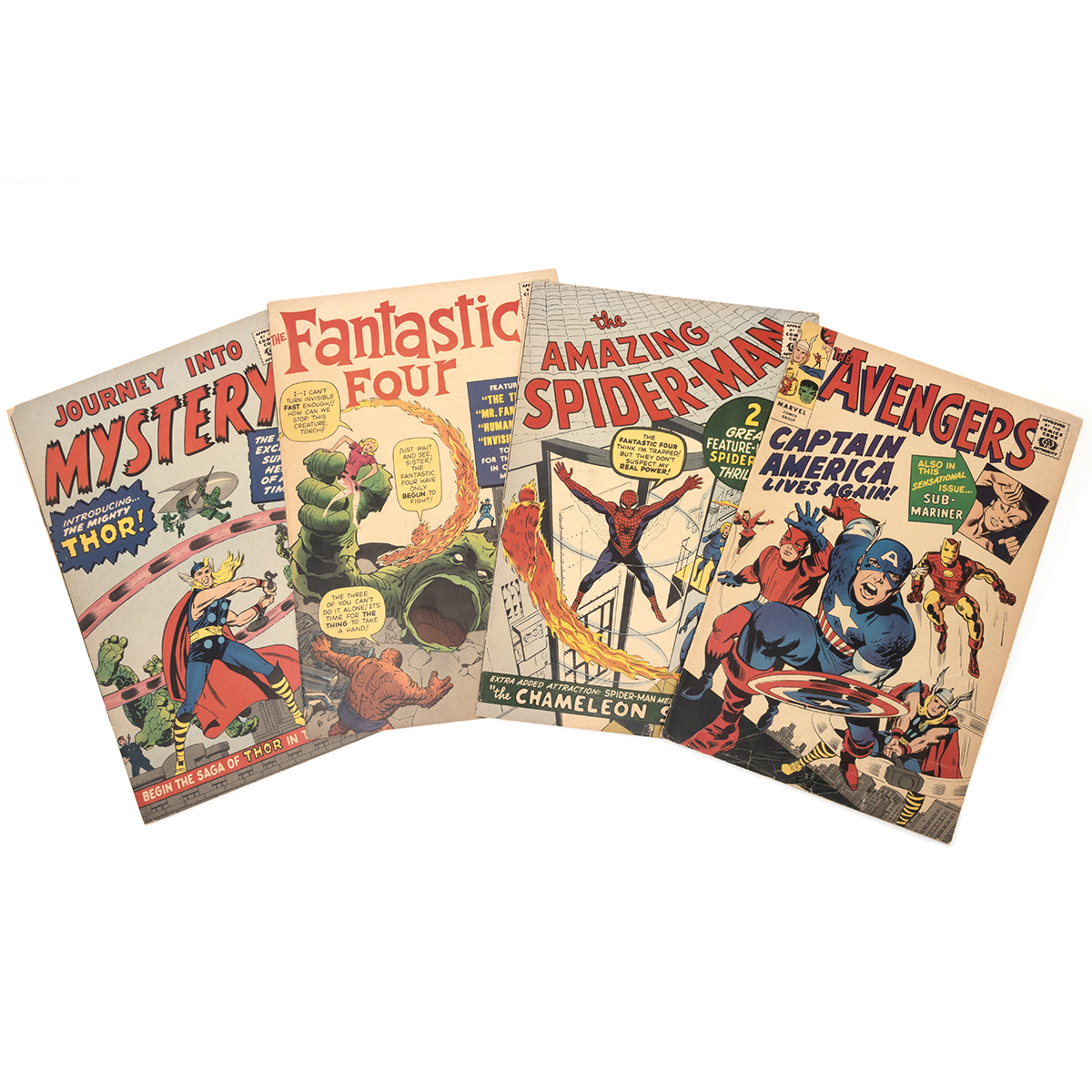 Four Golden Age Reprint Comics Including Spiderman and Fantastic Four.